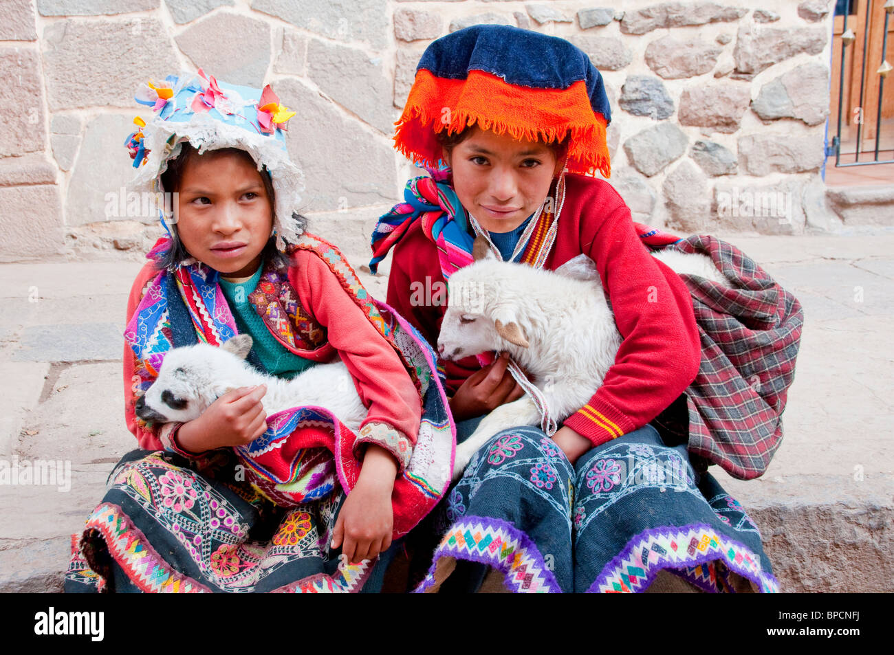 Peruvians in traditional dress in Pisac, Urubamba Valley, Peru, South America. Stock Photo