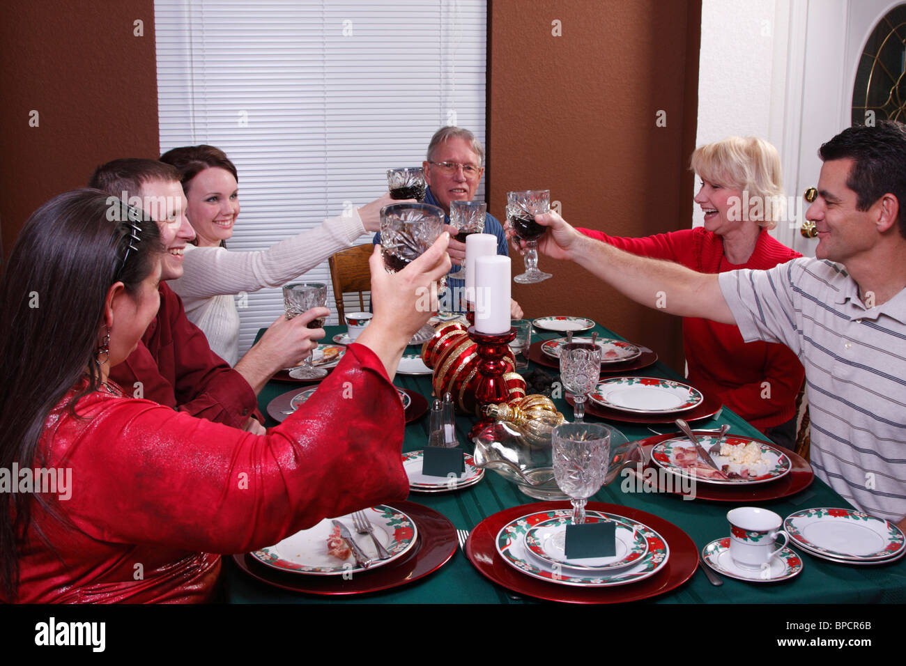Family toasting at Christmas dinner Stock Photo Alamy