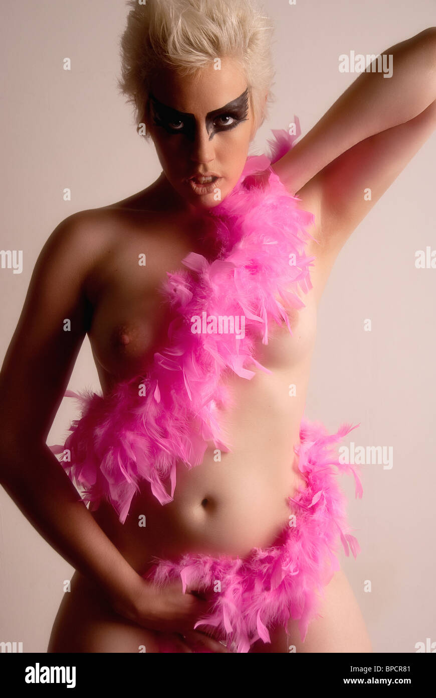 naked girl with feather boa round her Stock Photo
