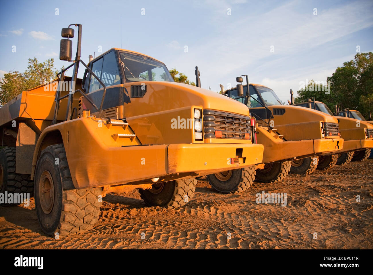 edmonton, alberta, canada; row of parked dump trucks Stock Photo - Alamy