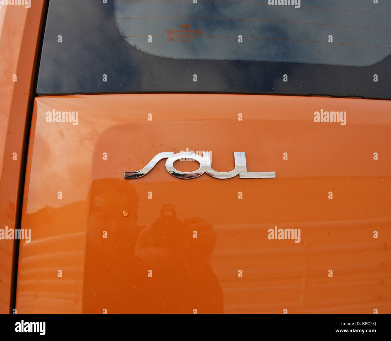 Kia Soul 1.6 - MY 2008 - orange - Korean popular subcompact mini van car, small MPV - Soul's logo, badge, emblem Stock Photo
