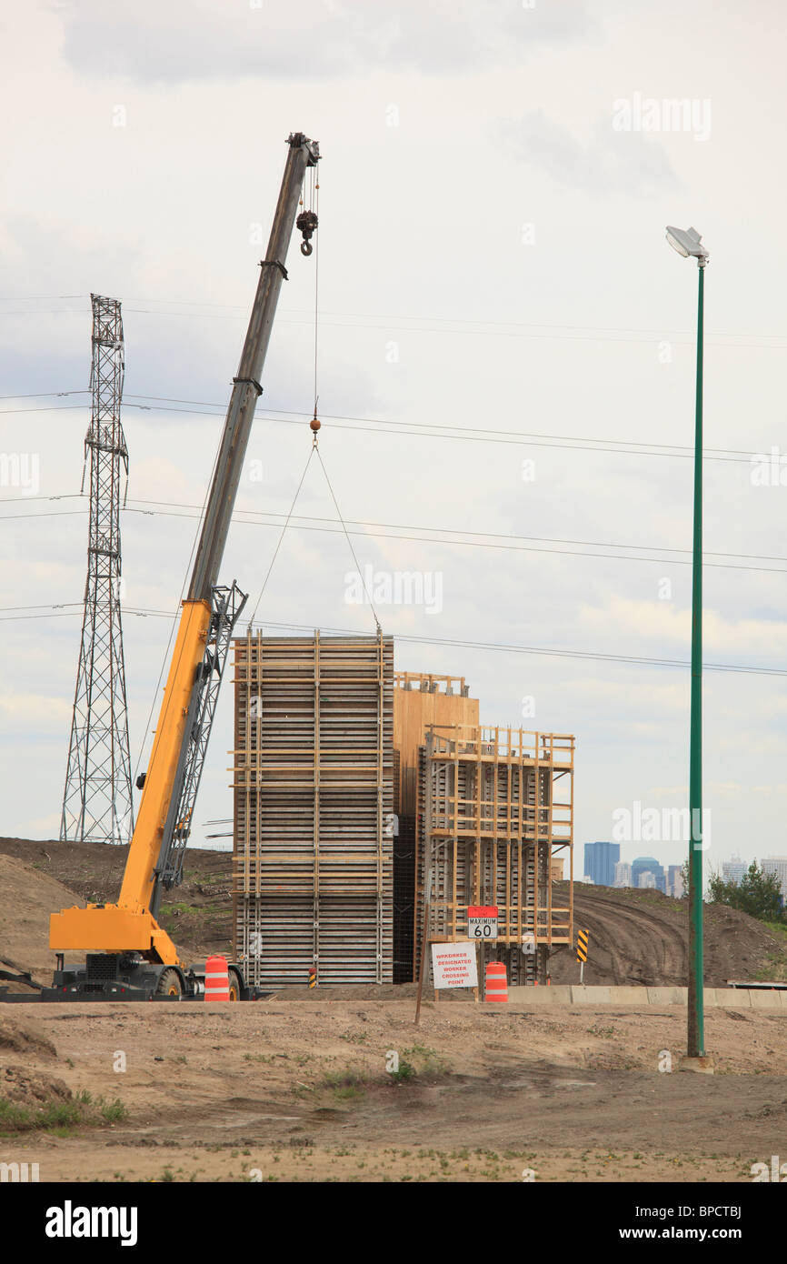 edmonton, alberta, canada; crane putting concrete form in place for
