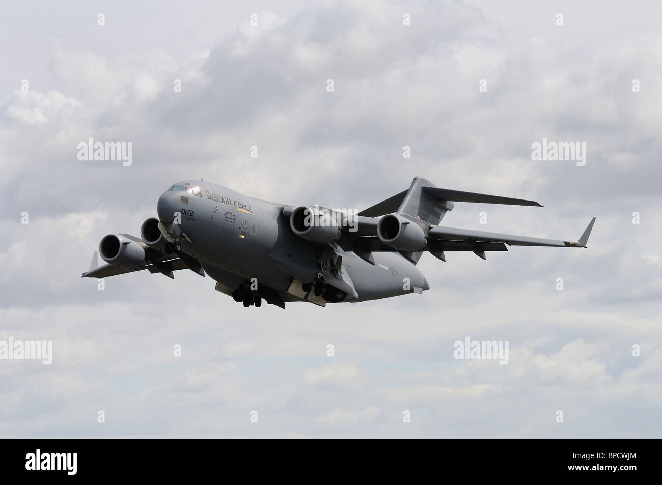 Boeing C-17A Globemaster III Number 00172 from the US Air Force 97th AMW,  Altus AFB,  The Spirit of Denali, makes a low pass at Stock Photo