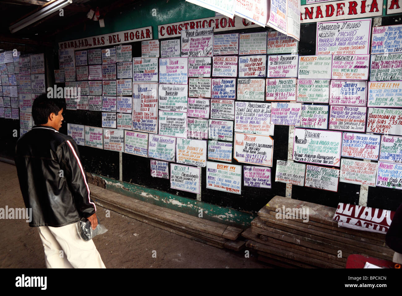 Young man looking for work inside unemployment office , Cusco , Peru Stock Photo