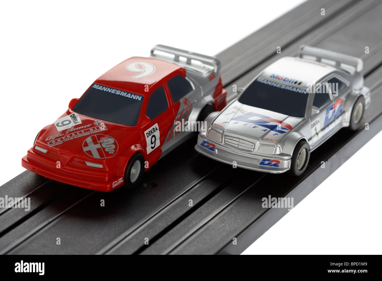 micro slot racing cars on track from the 1980s historic boys toy manufactured by scalextric Stock Photo