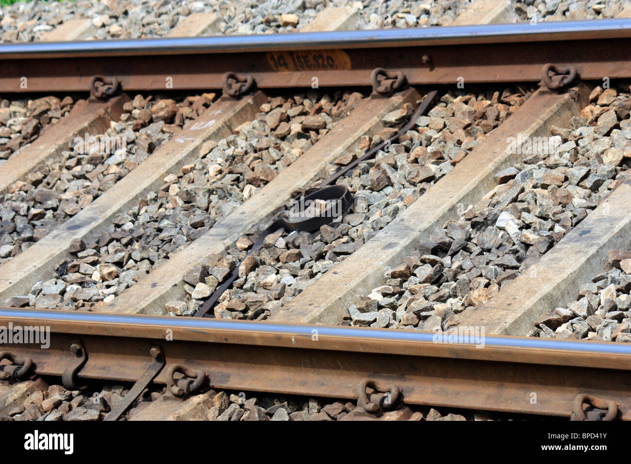 A railway line close up railings - railway tracks Stock Photo