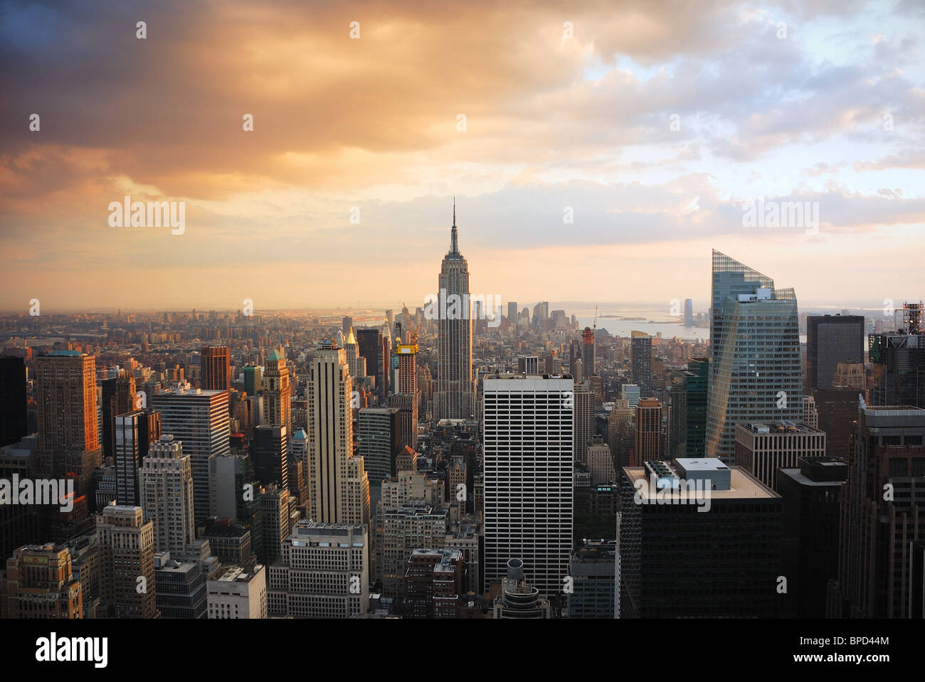 New York City Manhattan skyline at sunset with empire state building ...