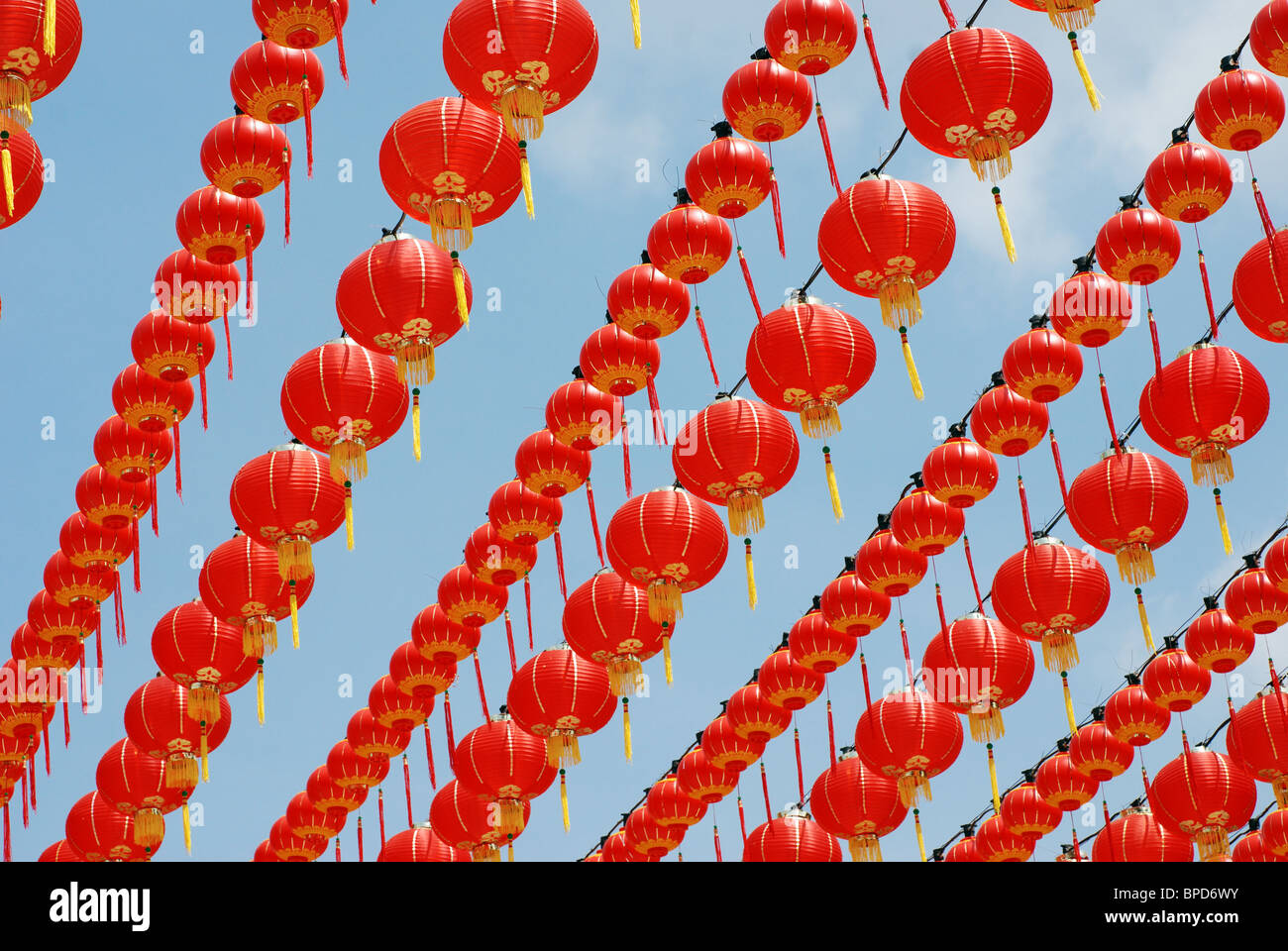 Chinese red lanterns hanging in rows above Stock Photo - Alamy