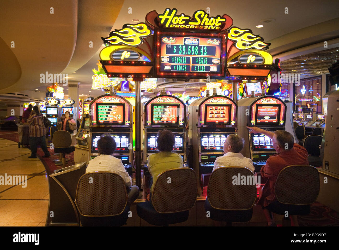 Gamblers trying their luck on the slot machines, Harrah's Casino, Las Vegas, Nevada, USA Stock Photo