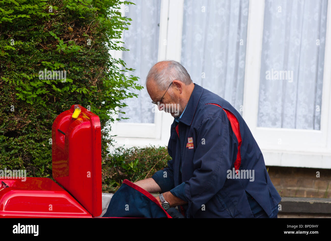 English postman uniform hi-res stock photography and images - Alamy