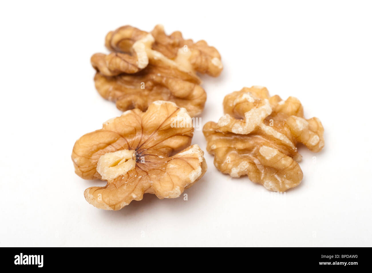 Roasted shelled walnuts On white Background Stock Photo