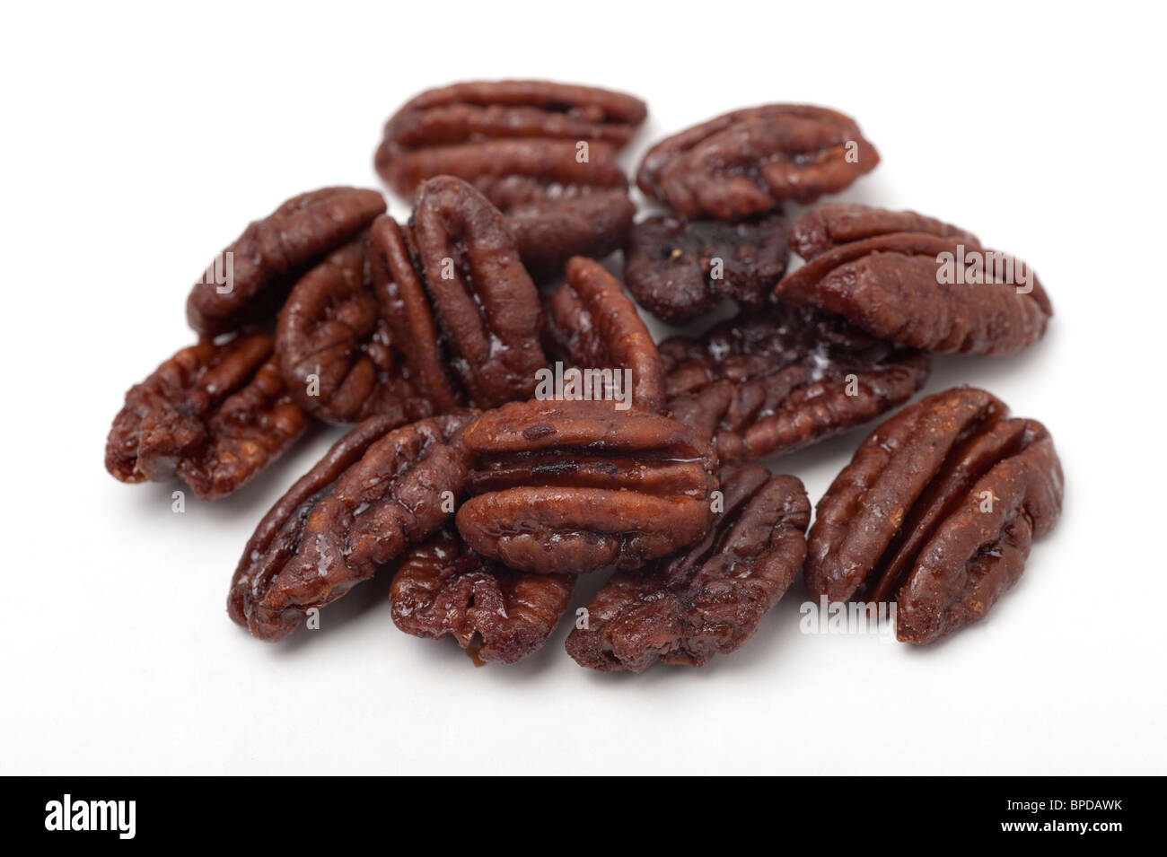 sugared Pecan Nuts (Carya illinoensis) On white Background Stock Photo