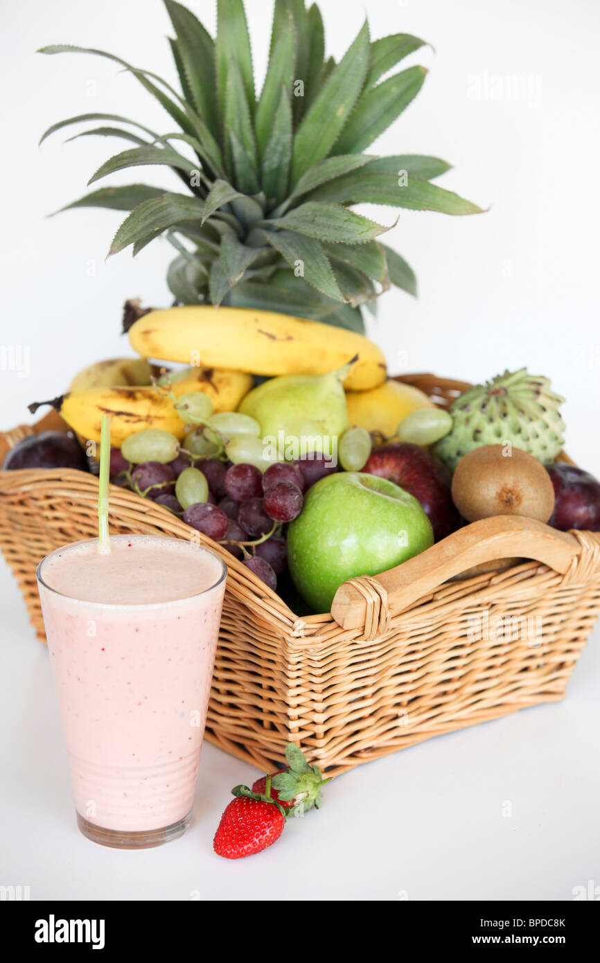 Fruit Health drink with a basket of fresh fruit on white background Stock Photo