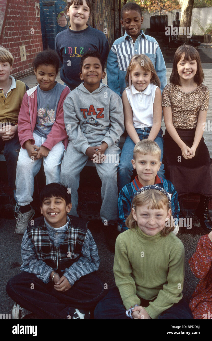 group of Primary school children posing in the playground Stock Photo