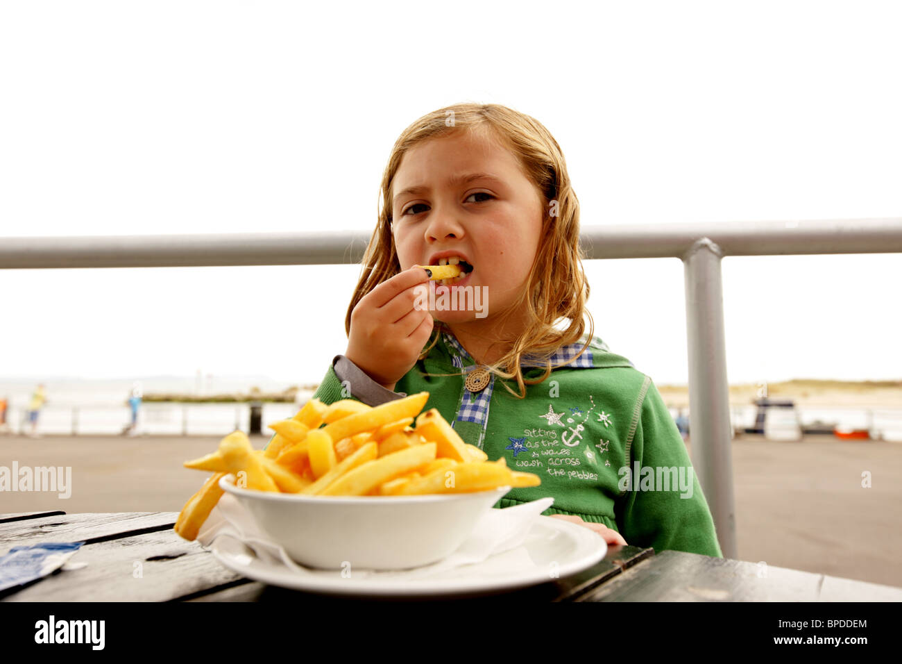 Child Eating Chips Stock Photo Alamy