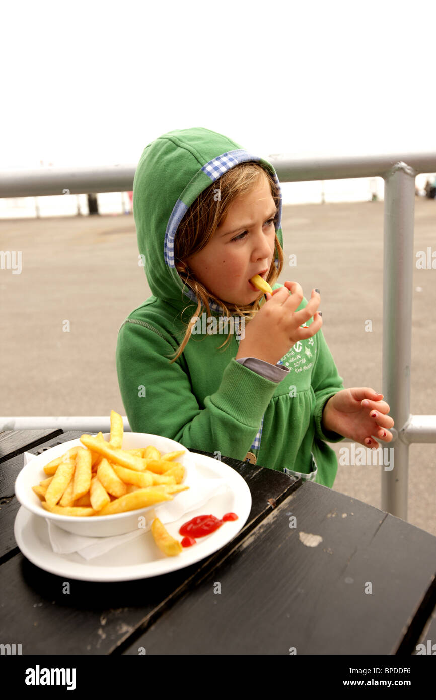 Child Eating Chips Stock Photo Alamy