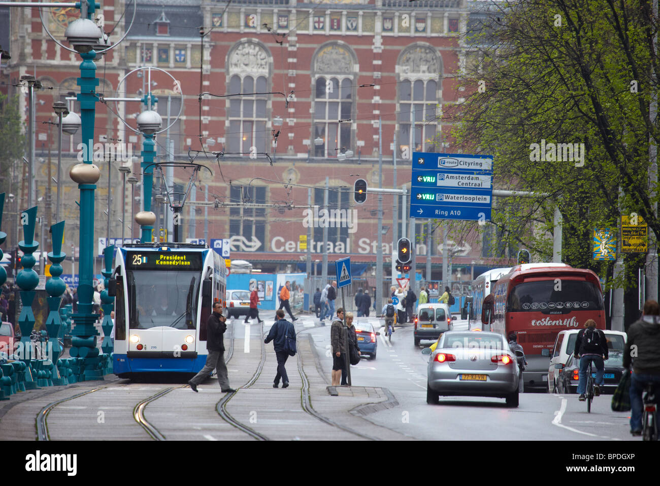 Tram 25 on Damrak street in Amsterdam Stock Photo