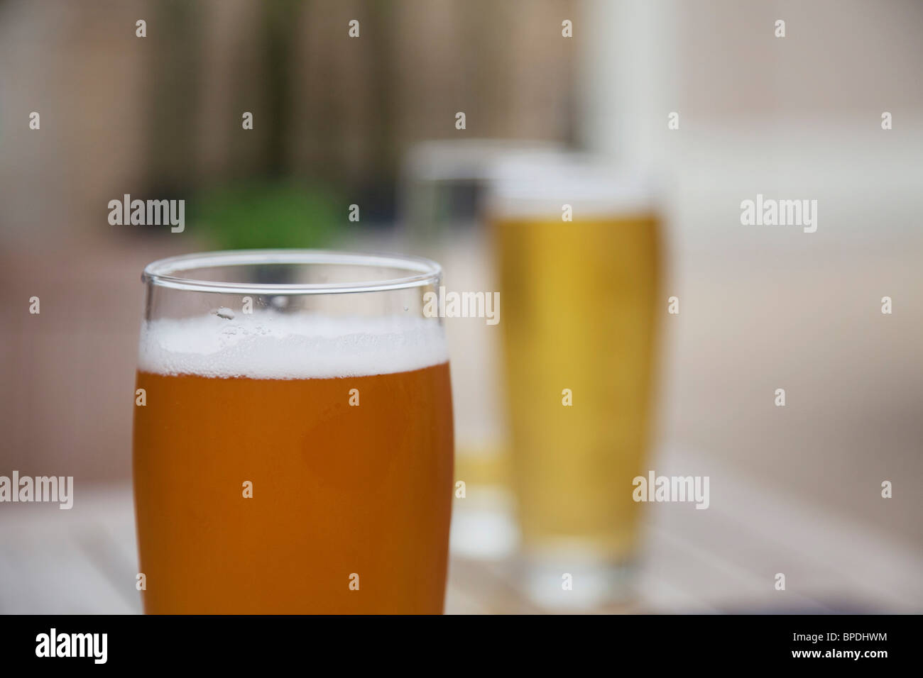Two pints of beer. One lager, and one ale. Stock Photo
