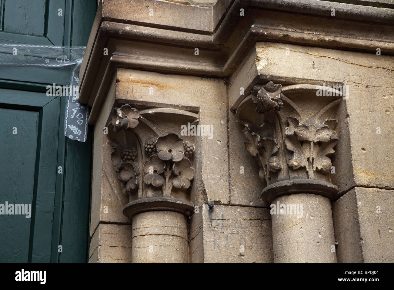 Stone columns and capitals, with ornate wedding ribbon Stock Photo - Alamy