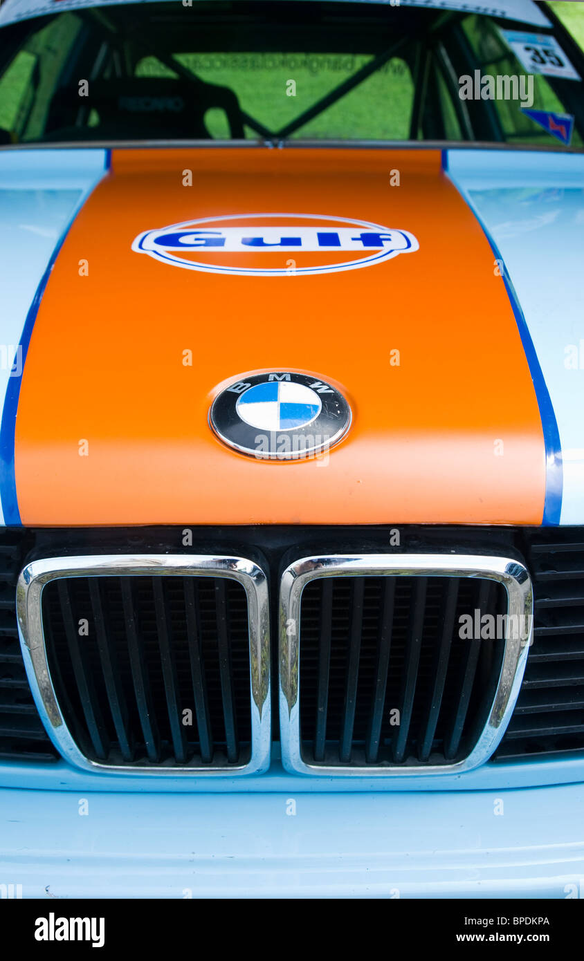 Bonnet and radiator grill of classic BMW 3-series in traditional Gulf Oil racing livery. Stock Photo