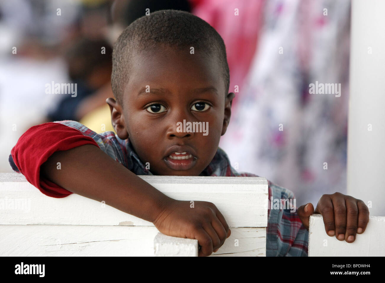 A boy looking at the photographer, Dubai, United Arab Emirates Stock Photo