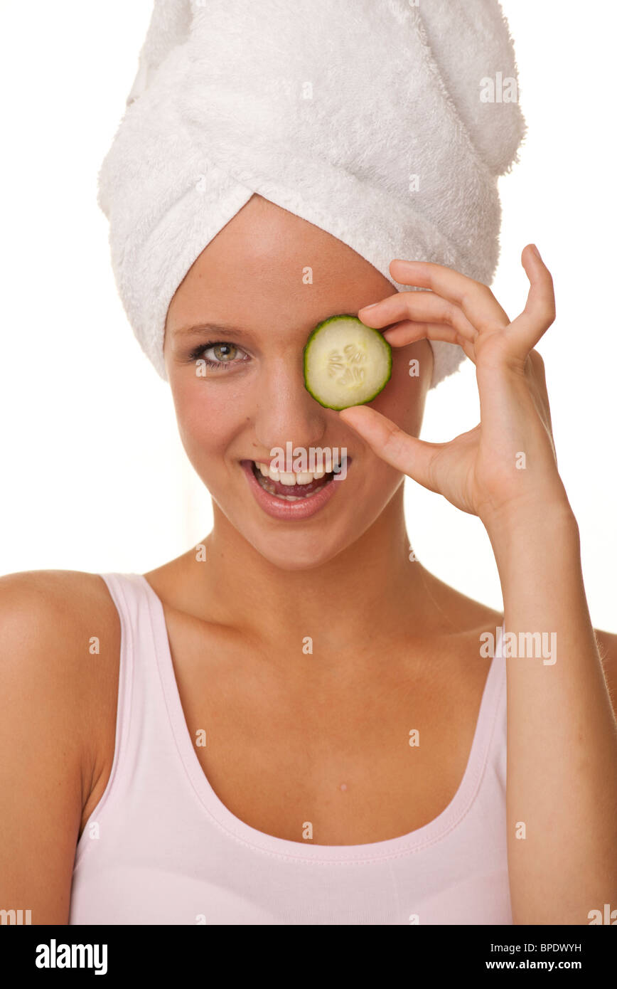 Woman holding cucumber over eye hires stock photography and images Alamy
