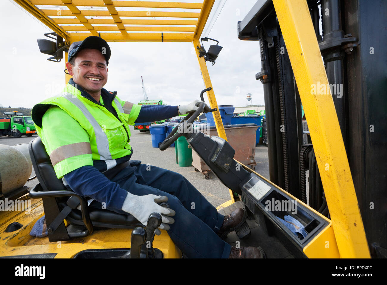 Hispanic man driving forklift Stock Photo