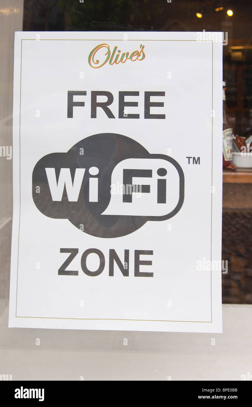 A sign advertising Free Wifi zone at Olive's cafe in Norwich , Norfolk , England , Great Britain , Uk Stock Photo