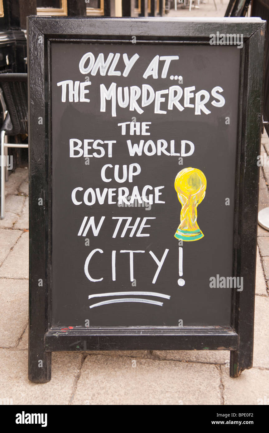 A sign outside The Murderers pub advertising World Cup Football in Norwich , Norfolk , England , Great Britain , Uk Stock Photo
