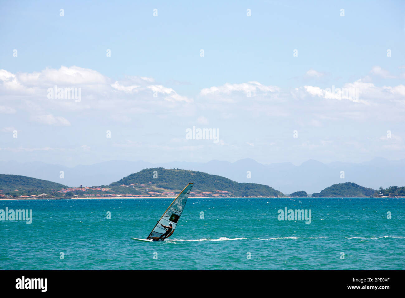 Windsurfer at Manguinhos Beach, Buzios, Rio de Janeiro State, Brazil. Stock Photo