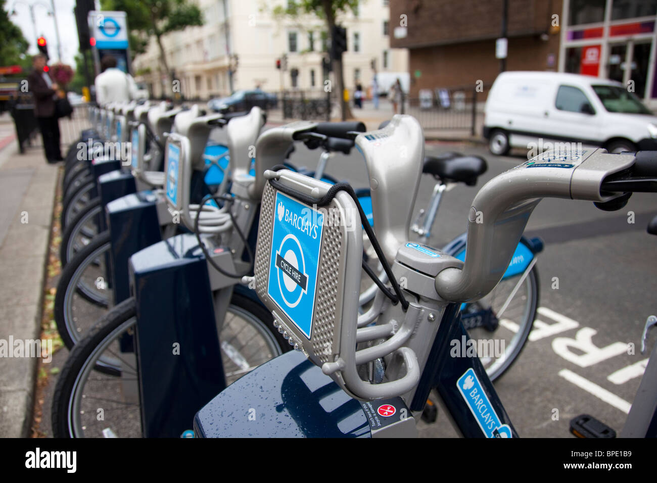 Hire bike docking station on Queen's Gate, South Kensington. Part of the Transport for London bicycle hire scheme. London UK Stock Photo