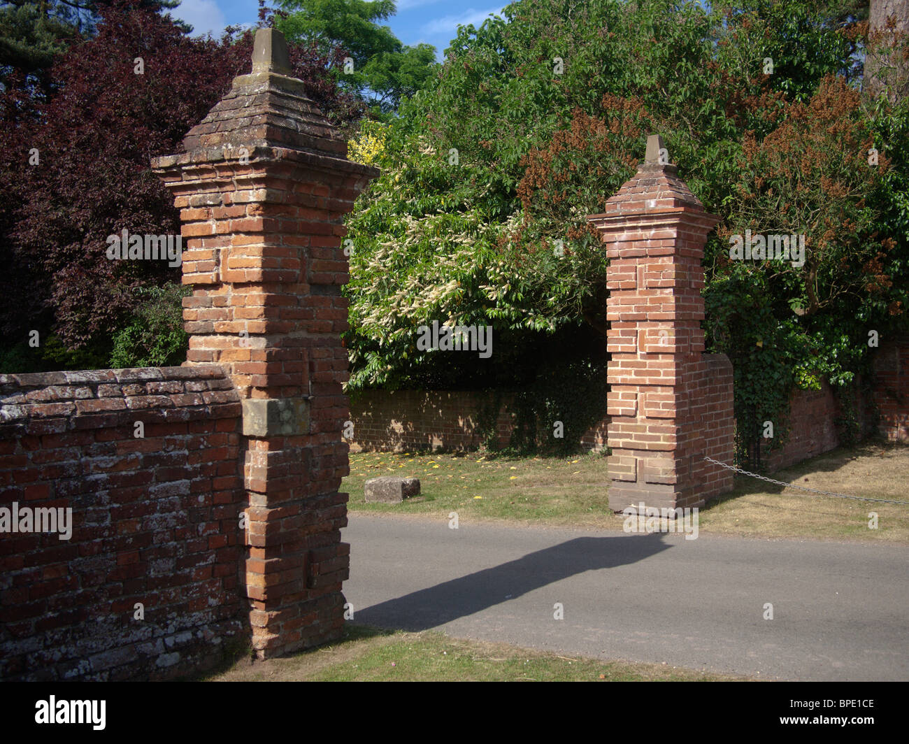 gates on a country lane Stock Photo Alamy