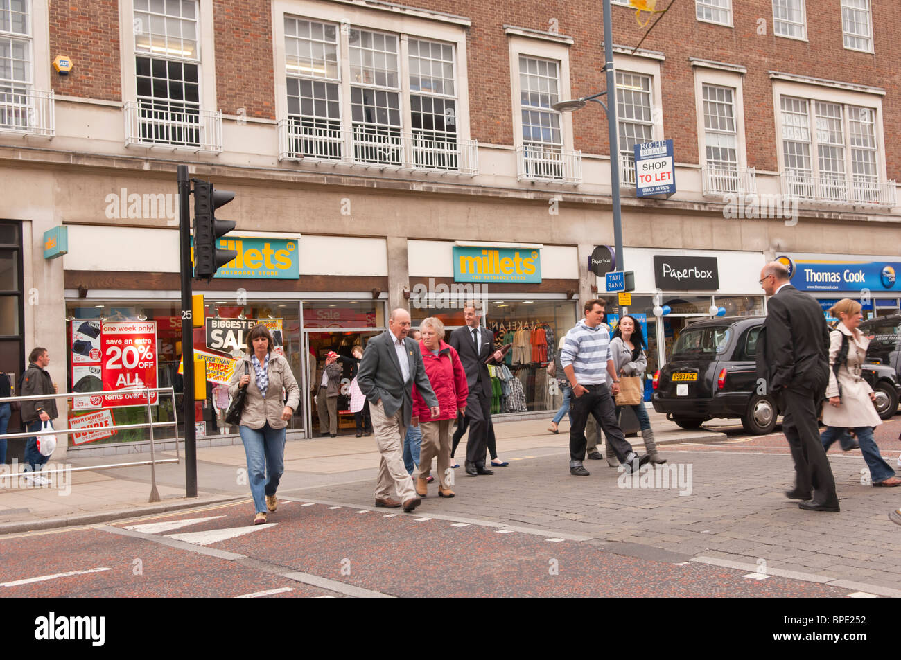 Pedestrians crossing on a pedestrian crossing in Norwich , Norfolk , England , Great Britain , Uk Stock Photo