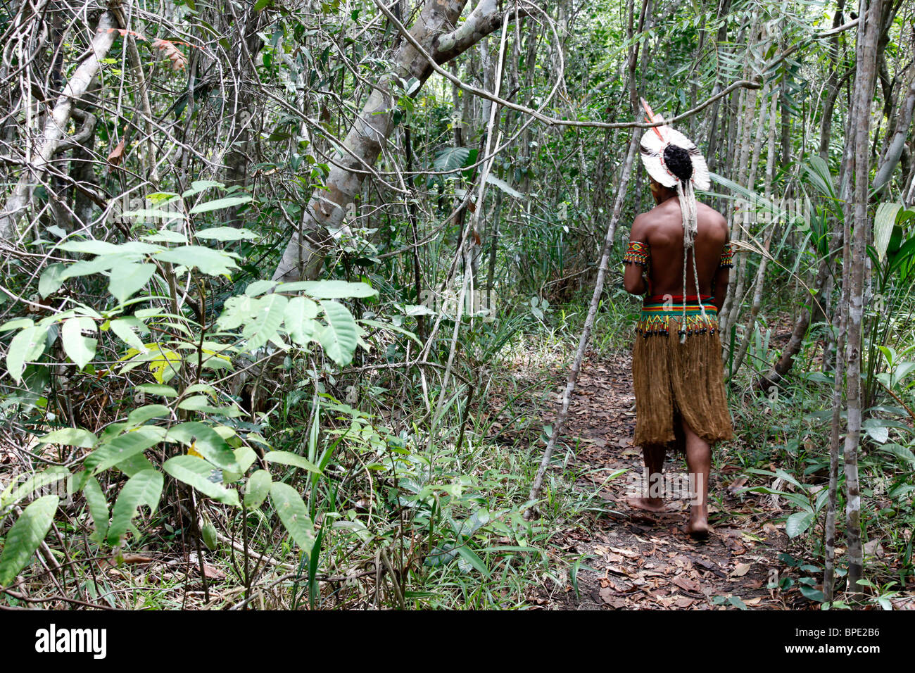 Pataxo Indian man walking at the Reserva Indigena da Jaqueira near Porto Seguro, Bahia, Brazil. Stock Photo