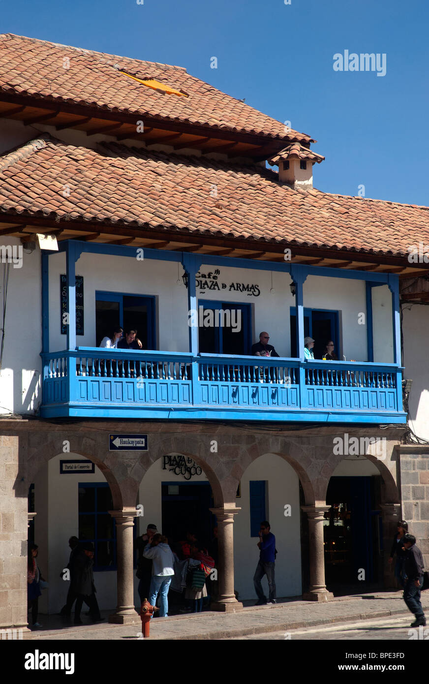 People dining and enjoy the view at a balcony restaurant in the Plaza de Armas Cusco Peru Stock Photo