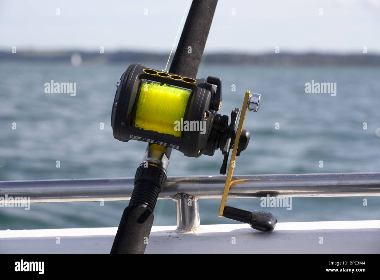 sea fishing on a boat with rod and multiplier reel Stock Photo - Alamy