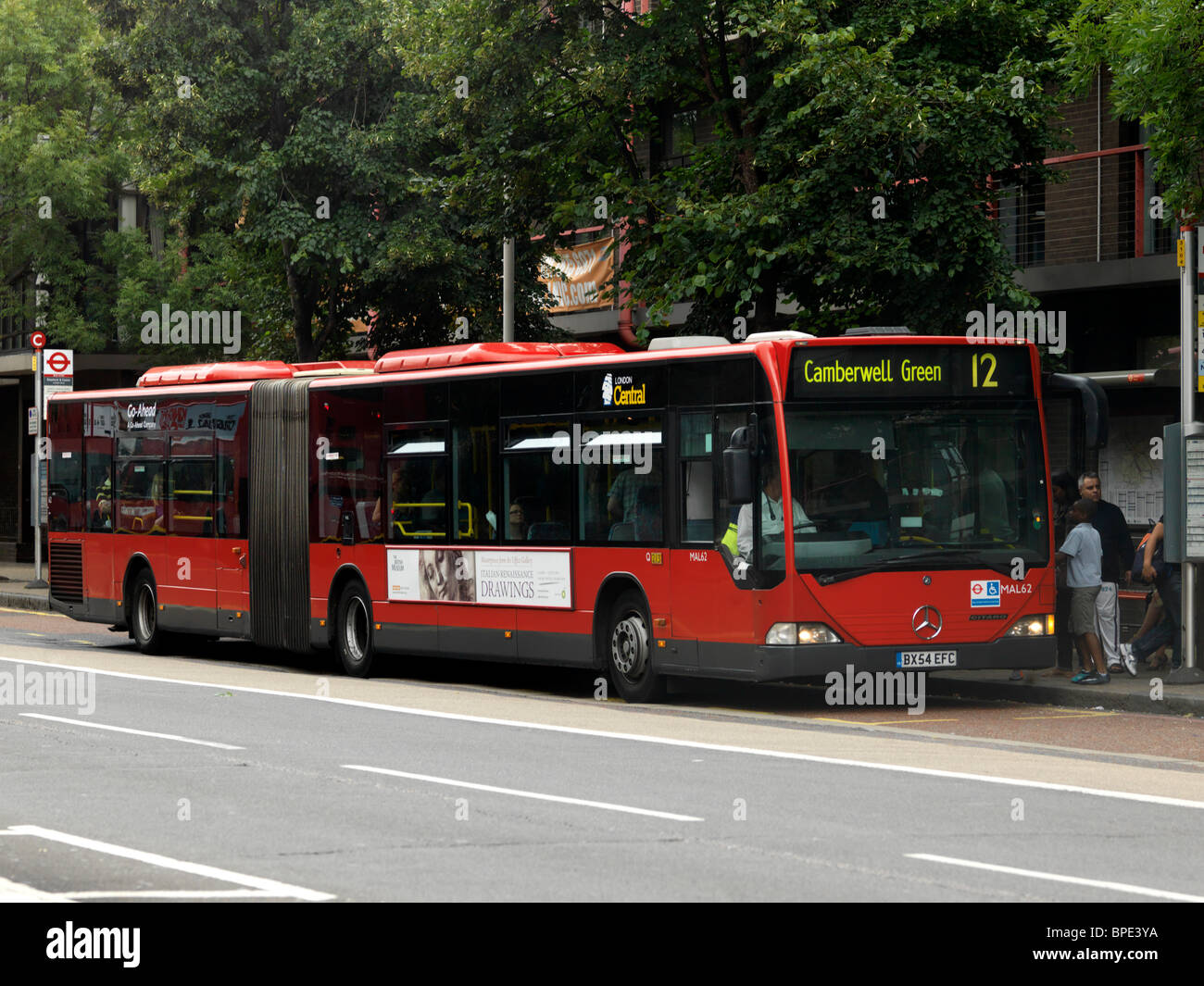 London England Articulated Bus At Bus Stop Stock Photo Alamy