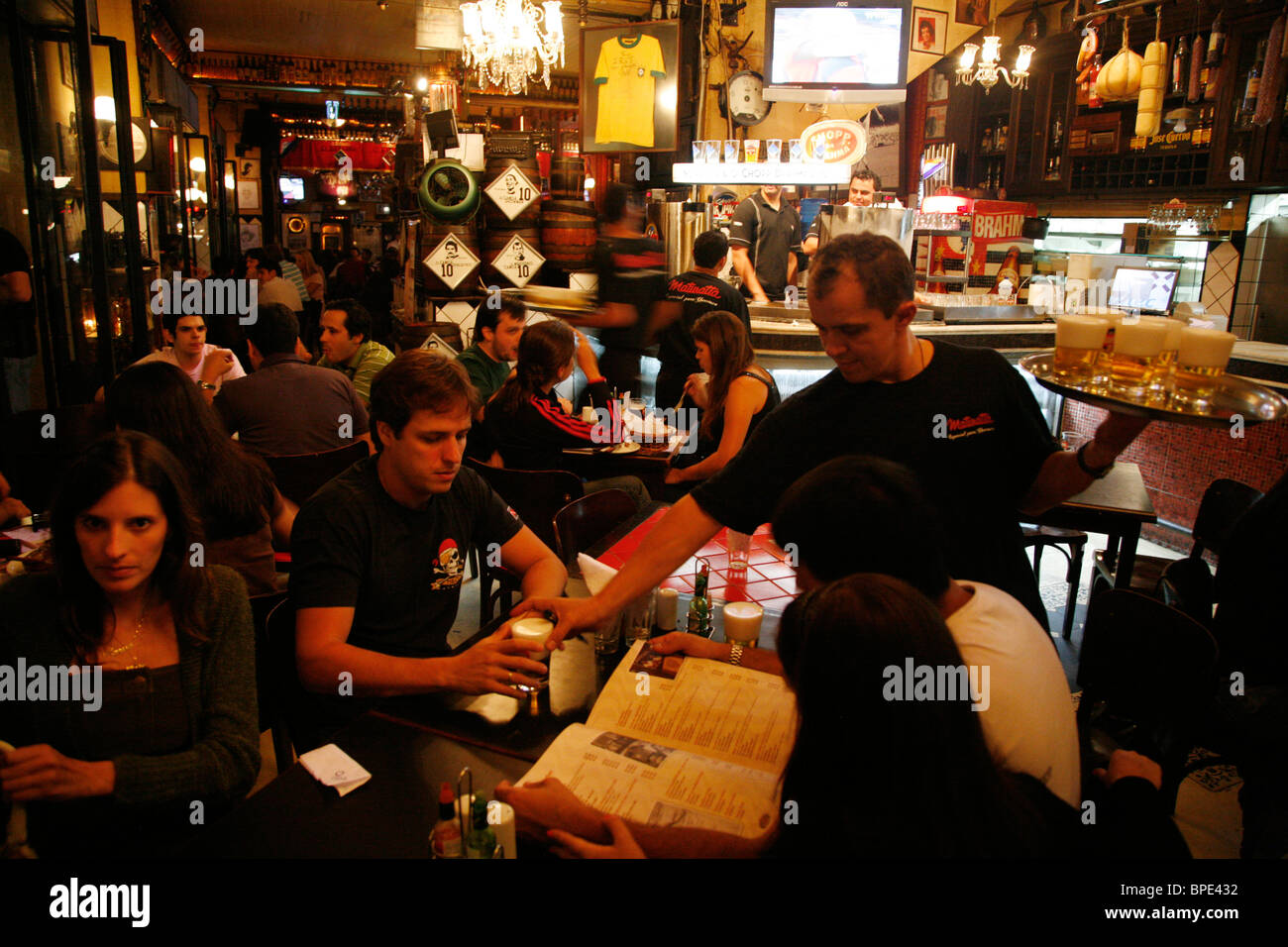 People in a restaurant at the Vila Madalena area known for its Bars restaurants and nighlife scenes. Sao Paulo, Brazil. Stock Photo