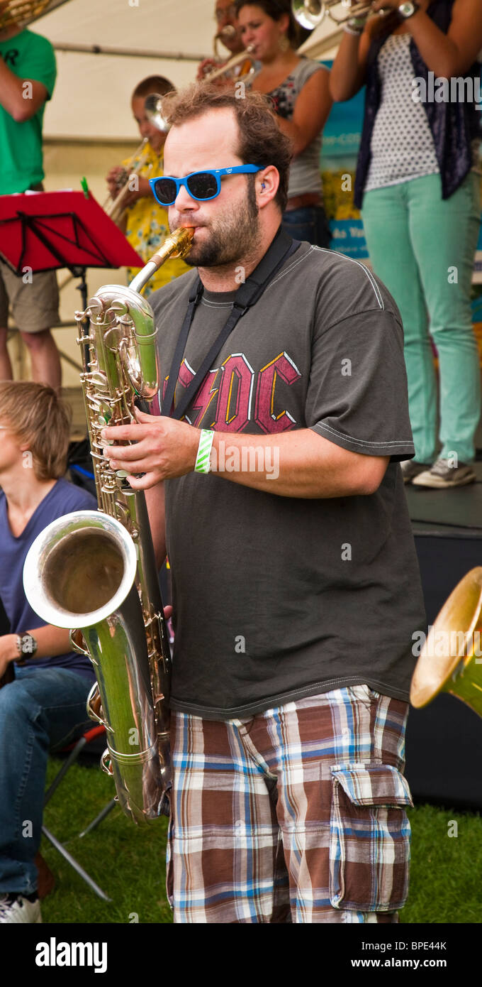 Male saxophonist playing at Edinburgh Mela 2010. Member of the Stroat Ensemble, a Dutch Big BrassBand. Scotland, Great Britain, Stock Photo