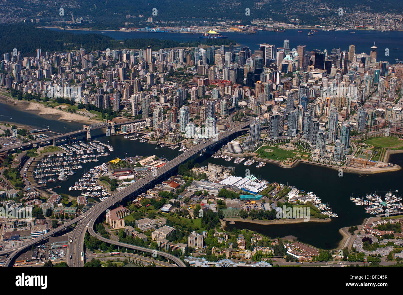 Granville Bridge, Granville Island, False Creek Burrard Bridge, First Beach, English Bay, North Vancouver and West Vancouver, aerial Stock Photo