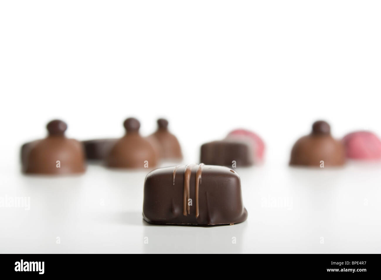 Chocolate candy with caramel drizzled on top. More gourmet candies in