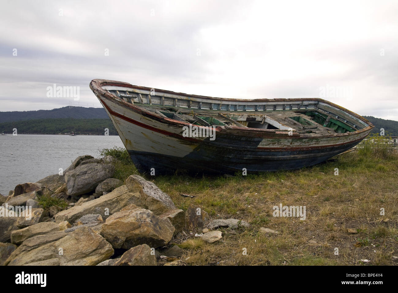 Abandoned fishing boat made of wood in Noia sea coast, Galicia, Spain. Stock Photo