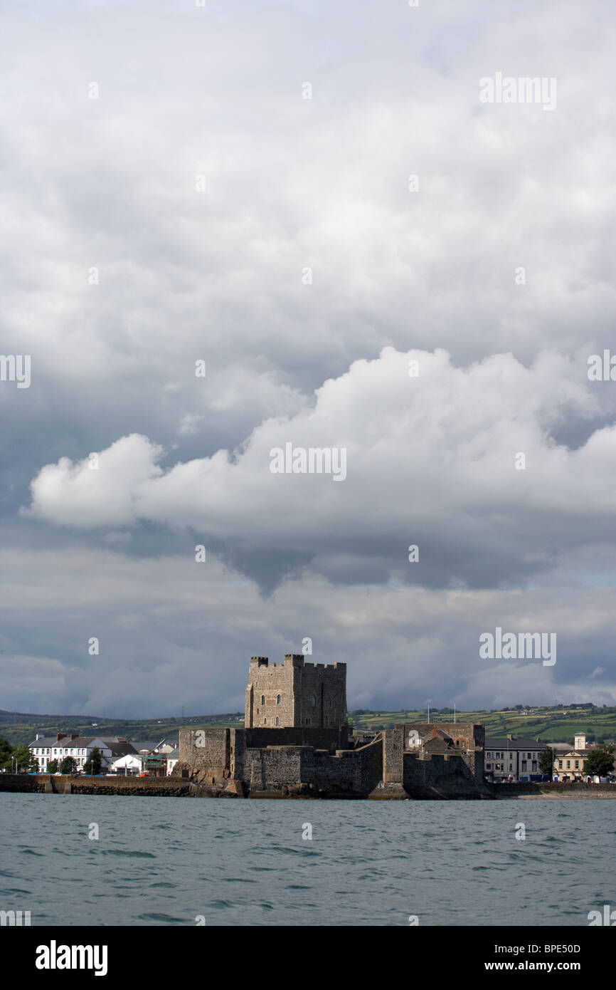 carrickfergus castle under a stormy sky county antrim northern ireland uk viewed from the sea Stock Photo