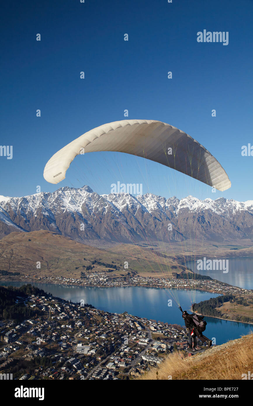 Paraglider Taking Off From The Skyline, Queenstown, South Island, New Zealand Stock Photo