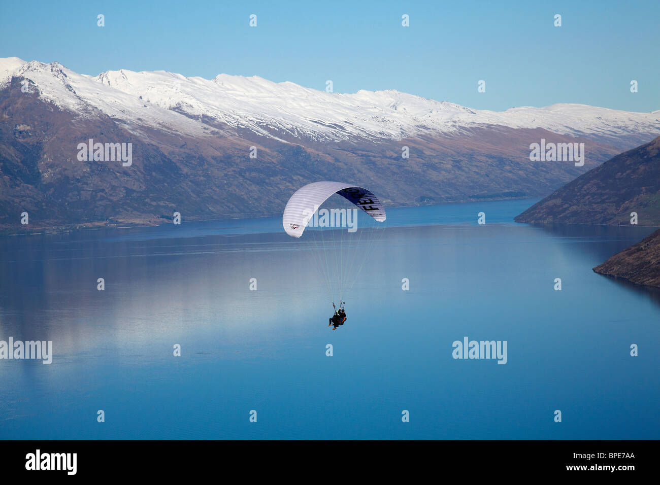 Paraglider, The Remarkables and Lake Wakatipu, Queenstown, South Island, New Zealand Stock Photo