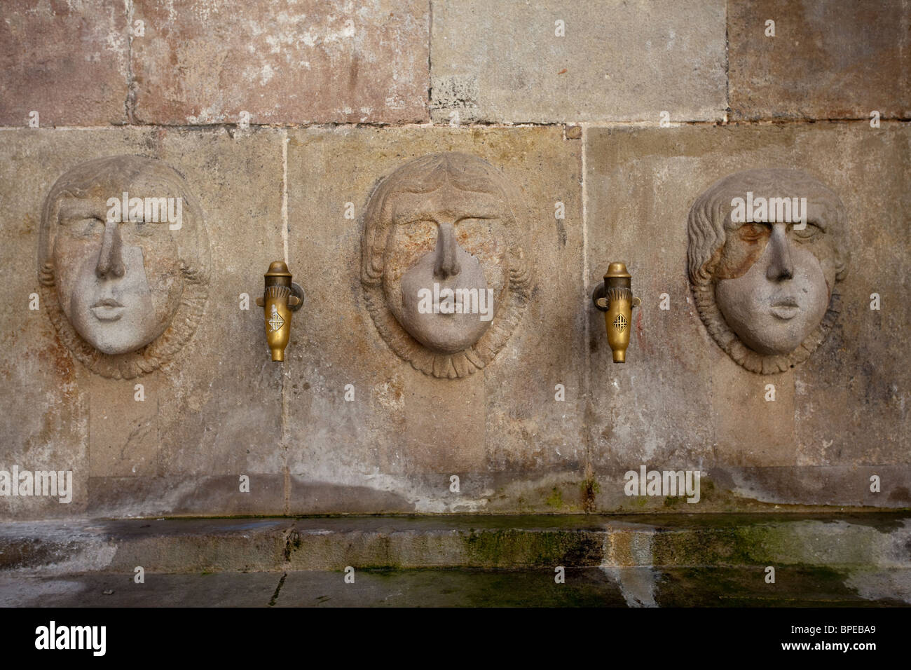 Barcelona Barri Gotic fountainheads beside church of Sants Just i Pastor Stock Photo
