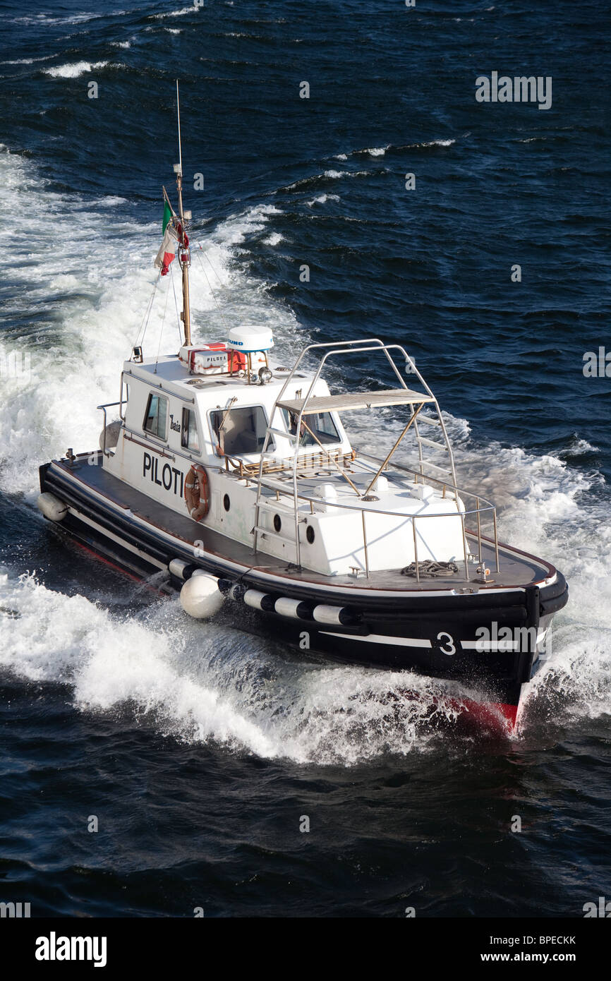 high speed pilot launch coming alongside passenger ship Naples Italy