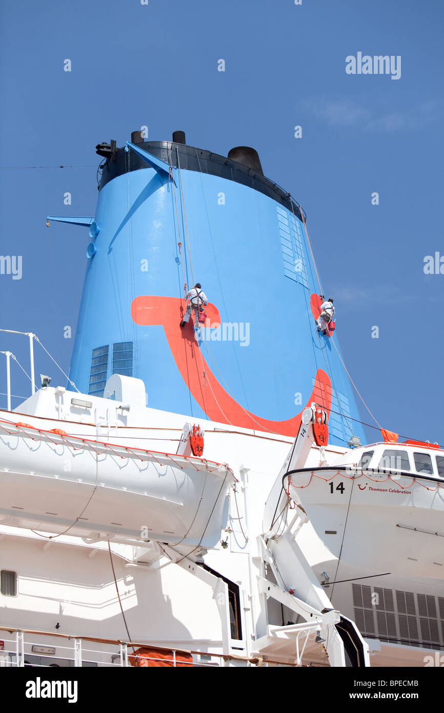 painting and maintenance on ship's funnel.Thomson cruise ship "Thomson Celebration". Corfu Stock