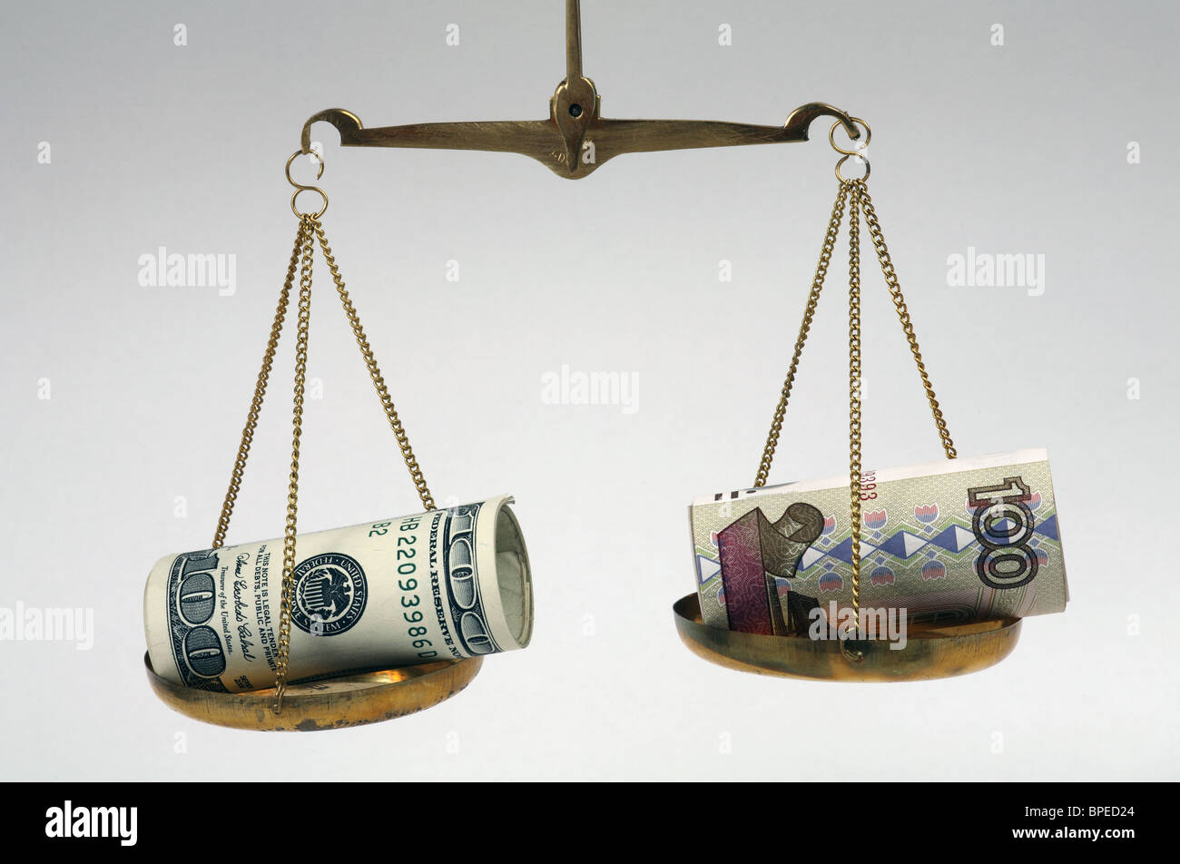 Dollar and ruble banknotes on balanced scales Stock Photo