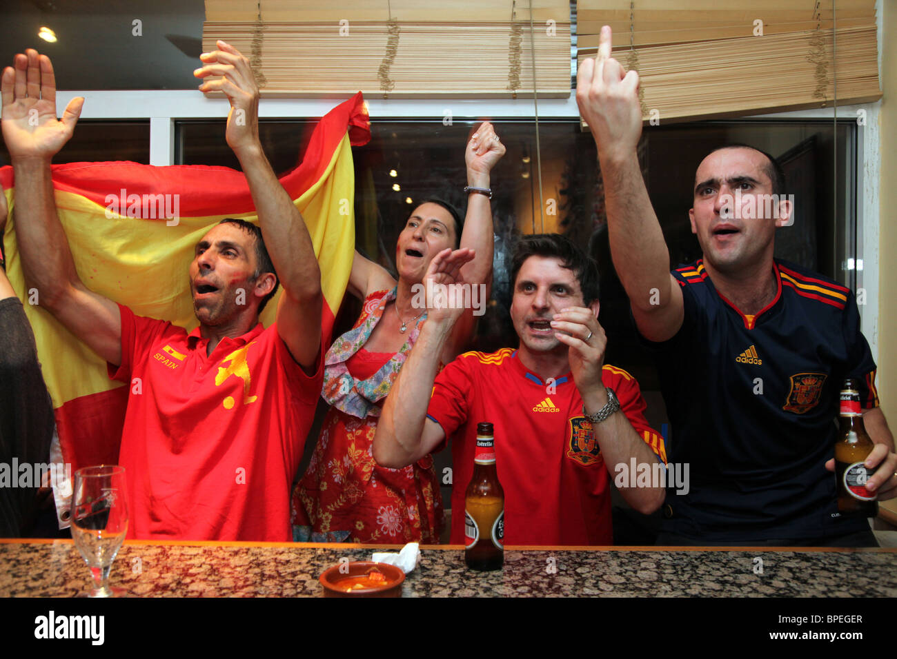 Supporters of Spain cheer and celebrate as their country wins the world cup final. Taken in a restaurant/bar in London Stock Photo